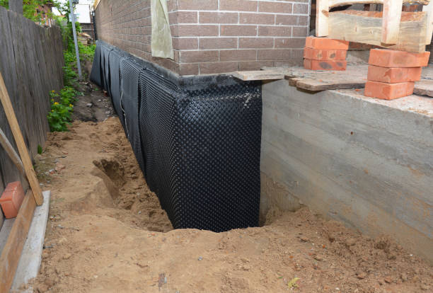 Happy homeowners after waterproofing job in Mount Rainier